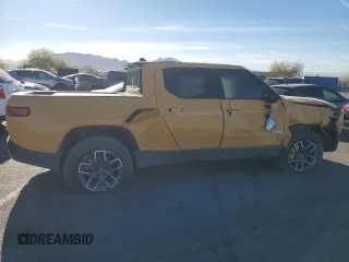 2022 Rivian R1T Launch Edition z VIN 7FCTGAAL2NN011755, wystawiony jako Copart lot #81940684 z przebiegiem Nie podano mil oraz Szkoda całkowita • Salvage title. Historia ofert i sprzedaży dostępna na DreamBid. Obrazek 3.