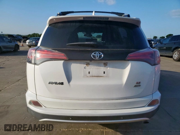 2016 Toyota RAV4 SE with VIN 2T3JFREV2GW456003, listed as a Copart auction lot 64136325 with 133,746 mi miles and Salvage title. Bid and sale history available at DreamBid. Image 6.