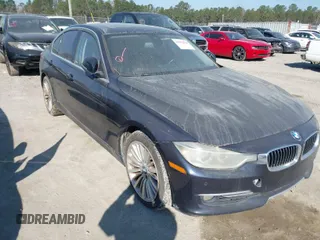 2014 BMW 3 Series 335i with VIN WBA3A9C54EF477943, listed as a IAAI auction lot 41632554 with 102,273 mi miles. Bid and sale history available at carsss.com. Image 1.