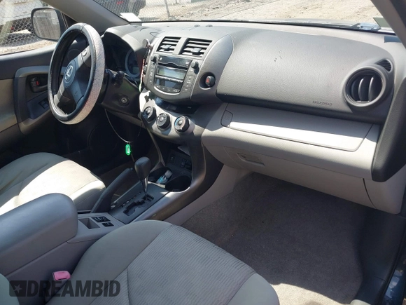 2009 Toyota RAV4 with VIN JTMBK33V39D006022, listed as a IAAI auction lot 42121581 with 227,663 mi miles. Bid and sale history available at carsss.com. Image 5.