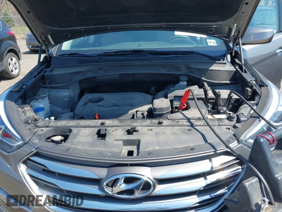 2017 Hyundai Santa Fe 2.4L z VIN 5NMZUDLB7HH015347, wystawiony jako IAAI lot #42035606 z przebiegiem 118 305 mil mil oraz . Historia ofert i sprzedaży dostępna na DreamBid. Obrazek 10.