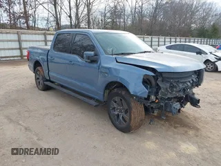 2023 Ford F-150 Lightning Pro with VIN 1FT6W1EVXPWG34958, listed as a IAAI auction lot 41732898 with 10,573 mi miles. Bid and sale history available at carsss.com. Image 1.