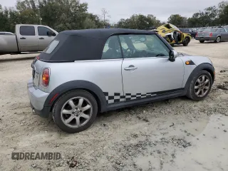 2009 MINI Convertible с VIN WMWMR33579TU95581, выставлен на аукционе Copart как лот 45914735 с пробегом 129 790 миль миль и Списание • Salvage title. История ставок и продаж доступна на DreamBid. Изображение 3.