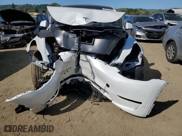 2024 Tesla Model Y Long Range with VIN 7SAYGDEE0RF081948, listed as a Copart auction lot 52612805 with 12,099 mi miles and Salvage Title. Bid and sale history available at DreamBid. Image 5.