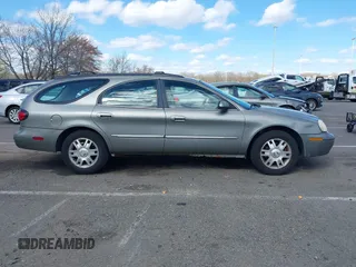 2004 Mercury Sable LS Premium z VIN 1MEFM59S74A609472, wystawiony jako IAAI lot #41971270 z przebiegiem 181 289 mil mil oraz . Historia ofert i sprzedaży dostępna na DreamBid. Obrazek 13.