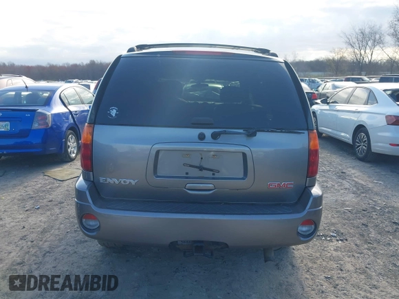 2005 GMC Envoy SLE with VIN 1GKDT13S852362380, listed as a IAAI auction lot 42031727 with 76,711 mi miles. Bid and sale history available at carsss.com. Image 17.
