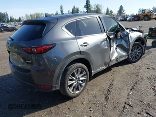 2019 Mazda CX-5 Grand Touring with VIN JM3KFBDM3K1677208, listed as a IAAI auction lot 41929299 with 58,163 mi miles. Bid and sale history available at carsss.com. Image 4.
