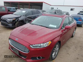 2016 Ford Fusion Titanium Hybrid with VIN 3FA6P0RU3GR355398, listed as a IAAI auction lot 41140669 with 125,959 mi miles. Bid and sale history available at carsss.com. Image 6.