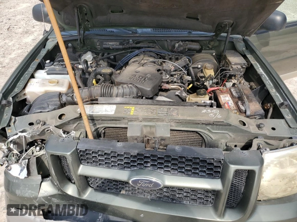 2003 Ford Explorer Sport XLS z VIN 1FMYU60E03UC12105, wystawiony jako Copart lot #67044604 z przebiegiem 277 642 mil mil oraz Szkody całkowita. Historia ofert i sprzedaży dostępna na DreamBid. Obrazek 11.