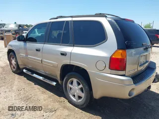 2003 GMC Envoy SLT with VIN 1GKDS13S732150215, listed as a IAAI auction lot 42048209 with 329,719 mi miles. Bid and sale history available at carsss.com. Image 3.