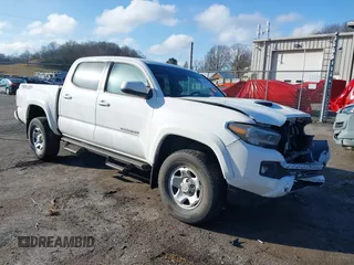 2023 Toyota Tacoma 4WD SR with VIN 3TMCZ5AN1PM538367, listed as a IAAI auction lot 41468684 with 28,879 mi miles. Bid and sale history available at carsss.com. Image 1.