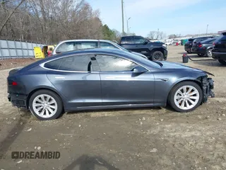 2017 Tesla Model S 100D with VIN 5YJSA1E23HF198592, listed as a IAAI auction lot 41721755 with 127,946 mi miles. Bid and sale history available at carsss.com. Image 14.
