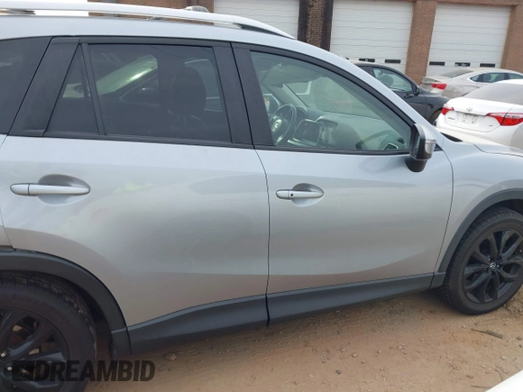 2016 Mazda CX-5 Grand Touring with VIN JM3KE4DY1G0616714, listed as a IAAI auction lot 41459781 with 90,763 mi miles. Bid and sale history available at carsss.com. Image 13.
