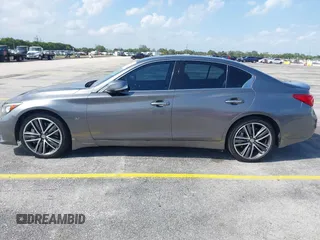 2015 Infiniti Q50 Premium z VIN JN1BV7AR3FM390743, wystawiony jako IAAI lot #41990093 z przebiegiem 91 350 mil mil oraz . Historia ofert i sprzedaży dostępna na DreamBid. Obrazek 14.