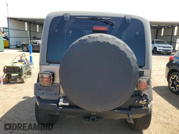 2004 Jeep Wrangler Rubicon with VIN 1J4FA69S64P751349, listed as a Copart auction lot 69642624 with 160,589 mi miles and Salvage Title. Bid and sale history available at carsss.com. Image 6.