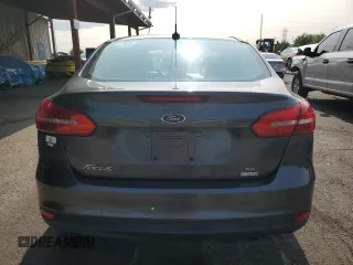 2016 Ford Focus SE z VIN 1FADP3FE7GL238752, wystawiony jako Copart lot #59226335 z przebiegiem 46 289 mil mil oraz Czysty tytuł • Clean title. Historia ofert i sprzedaży dostępna na DreamBid. Obrazek 6.