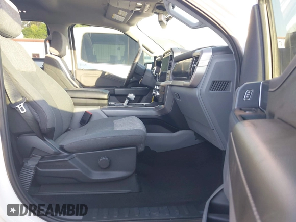 2023 Ford F-150 Lightning Pro with VIN 1FTVW1EL6PWG34059, listed as a IAAI auction lot 42010900 with 20,759 mi miles and . Bid and sale history available at DreamBid. Image 5.