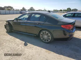 2019 BMW 5 Series M550i xDrive with VIN WBAJB9C50KB464503, listed as a Copart auction lot 56995825 with 67,324 mi miles and Salvage title. Bid and sale history available at DreamBid. Image 2.