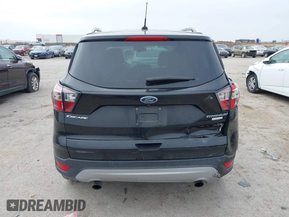 2017 Ford Escape Titanium with VIN 1FMCU0J93HUF10664, listed as a IAAI auction lot 41921588 with 88,377 mi miles. Bid and sale history available at carsss.com. Image 16.