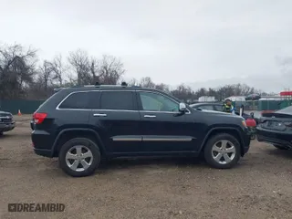 2013 Jeep Grand Cherokee Limited with VIN 1C4RJFBG0DC656382, listed as a IAAI auction lot 41870162 with 162,869 mi miles. Bid and sale history available at carsss.com. Image 13.
