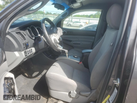 2014 Toyota Tacoma with VIN 3TMLU4EN2EM163797, listed as a Copart auction lot 61078805 with 130,748 mi miles and Salvage title. Bid and sale history available at DreamBid. Image 7.