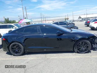 2022 Tesla Model S with VIN 5YJSA1E51NF464231, listed as a IAAI auction lot 42077838 with 53,290 mi miles and . Bid and sale history available at DreamBid. Image 14.