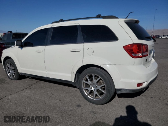 2013 Dodge Journey R/T with VIN 3C4PDCEG3DT659001, listed as a Copart auction lot 78187554 with 128,052 mi miles and Salvage title. Bid and sale history available at DreamBid. Image 2.