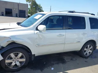 2013 Honda Pilot Touring with VIN 5FNYF4H92DB031589, listed as a IAAI auction lot 42159313 with 192,604 mi miles and . Bid and sale history available at carsss.com. Image 14.