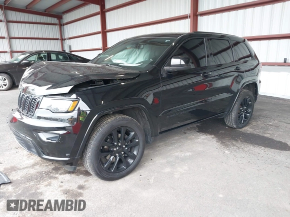 2019 Jeep Grand Cherokee Laredo E with VIN 1C4RJFAG0KC565739, listed as a IAAI auction lot 42039038 with 103,358 mi miles and . Bid and sale history available at DreamBid. Image 17.