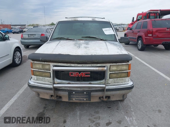 1997 GMC Yukon with VIN 1GKEK13R2VJ739795, listed as a IAAI auction lot 42011678 with 185,306 mi miles. Bid and sale history available at carsss.com. Image 6.