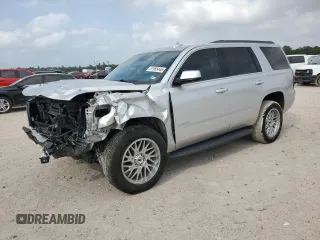 2020 Chevrolet Tahoe LS with VIN 1GNSCAKC9LR265813, listed as a Copart auction lot 51955445 with 63,647 mi miles and Salvage title. Bid and sale history available at DreamBid. Image 1.