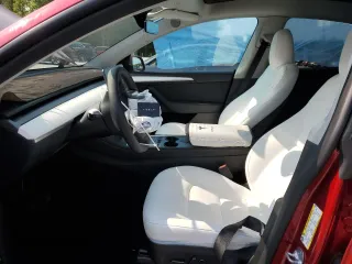 2024 Tesla Model Y Long Range with VIN 7SAYGDEE6RF995069, listed as a Copart auction lot 57085405 with 22,302 mi miles and Salvage title. Bid and sale history available at DreamBid. Image 7.