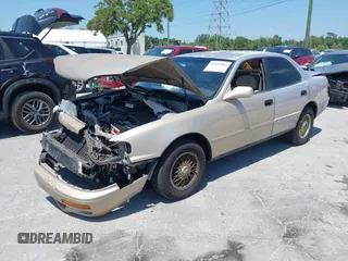 1995 Toyota Camry LE z VIN 4T1SK12E8SU872841, wystawiony jako IAAI lot #42025861 z przebiegiem 228 747 mil mil oraz . Historia ofert i sprzedaży dostępna na DreamBid. Obrazek 2.