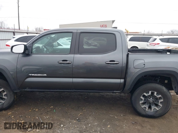 2022 Toyota Tacoma SR with VIN 3TMCZ5AN4NM476170, listed as a IAAI auction lot 41482149 with 57,126 mi miles and . Bid and sale history available at DreamBid. Image 14.