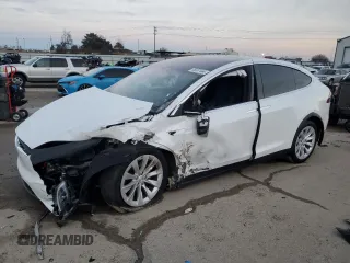 2021 Tesla Model X Long Range Plus with VIN 5YJXCAE28MF323662, listed as a Copart auction lot 85687444 with Not Provided miles and Salvage Title. Bid and sale history available at carsss.com. Image 1.