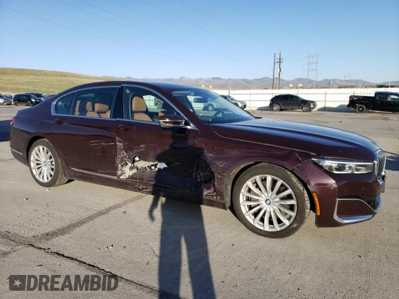 2020 BMW 7 Series with VIN WBA7W4C06LBM70555, listed as a Copart auction lot 52126455 with 37,375 mi miles and Salvage title. Bid and sale history available at DreamBid. Image 4.