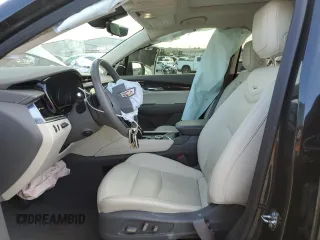 2021 Cadillac XT6 Premium Luxury z VIN 1GYKPCRS6MZ205831, wystawiony jako Copart lot #47259215 z przebiegiem 31 959 mil mil oraz Szkody całkowita. Historia ofert i sprzedaży dostępna na DreamBid. Obrazek 7.