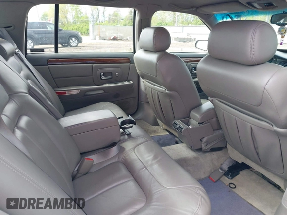 1999 Cadillac DeVille DHS z VIN 1G6KE54Y2XU752599, wystawiony jako IAAI lot #42141950 z przebiegiem 135 999 mil mil oraz . Historia ofert i sprzedaży dostępna na DreamBid. Obrazek 8.