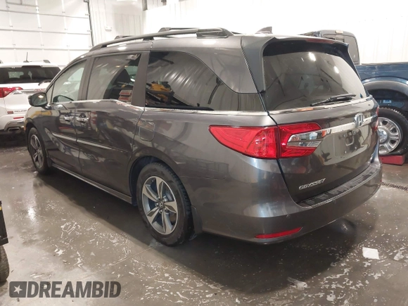 2018 Honda Odyssey Touring with VIN 5FNRL6H84JB041309, listed as a IAAI auction lot 42272247 with 90,371 mi miles and . Bid and sale history available at DreamBid. Image 3.