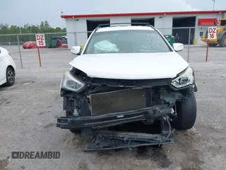2014 Hyundai Santa Fe with VIN 5XYZU3LB9EG229255, listed as a IAAI auction lot 42407410 with 201,523 mi miles and . Bid and sale history available at DreamBid. Image 6.