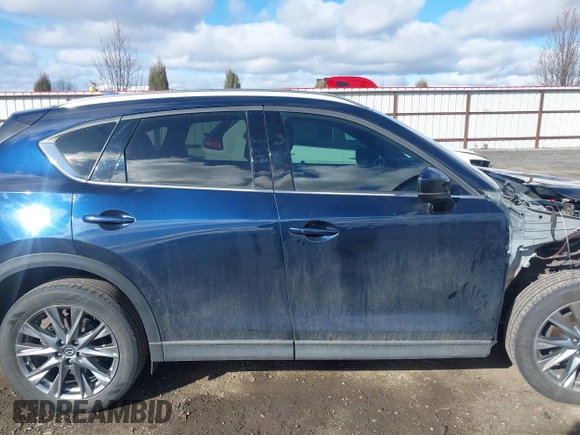 2019 Mazda CX-5 Signature with VIN JM3KFBEY5K0609063, listed as a IAAI auction lot 41802772 with 104,112 mi miles. Bid and sale history available at carsss.com. Image 14.
