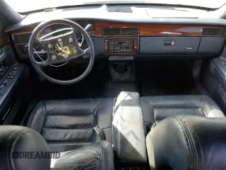 1995 Cadillac Concours z VIN 1G6KF52Y0SU301356, wystawiony jako Copart lot #77372694 z przebiegiem 132 934 mil mil oraz Szkody całkowita. Historia ofert i sprzedaży dostępna na DreamBid. Obrazek 8.