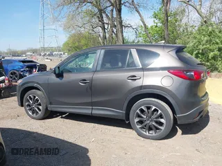 2016 Mazda CX-5 Grand Touring z VIN JM3KE4DY8G0846265, wystawiony jako IAAI lot #42102843 z przebiegiem 159 827 mil mil oraz . Historia ofert i sprzedaży dostępna na DreamBid. Obrazek 14.