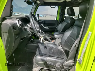 2012 Jeep Wrangler Unlimited Call of Duty MW3 z VIN 1C4BJWFG4CL242211, wystawiony jako Copart lot #59774555 z przebiegiem 117 463 mil mil oraz Szkoda całkowita • Salvage title. Historia ofert i sprzedaży dostępna na DreamBid. Obrazek 7.