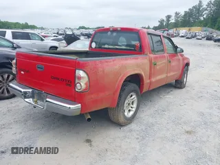 2004 Dodge Dakota SLT with VIN 1D7HL48N84S717599, listed as a IAAI auction lot 42132810 with 305,900 mi miles and . Bid and sale history available at carsss.com. Image 4.