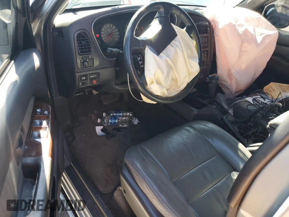 2000 Infiniti QX4 with VIN JNRAR07Y1YW077992, listed as a Copart auction lot 45572015 with 202,385 mi miles and Salvage Title. Bid and sale history available at DreamBid. Image 8.