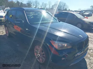 2013 BMW X1 28i with VIN WBAVM1C51DVW41977, listed as a IAAI auction lot 41607741 with 158,258 mi miles. Bid and sale history available at carsss.com. Image 1.