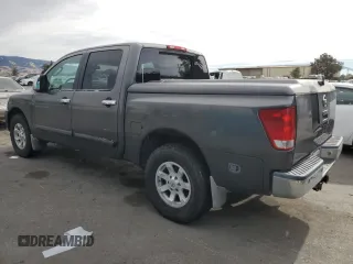 2005 Nissan Titan SE with VIN 1N6AA07B65N566082, listed as a Copart auction lot 80879174 with 215,297 mi miles and Clean Title. Bid and sale history available at carsss.com. Image 2.