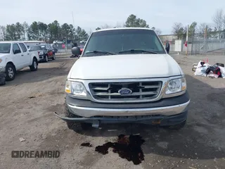 2000 Ford F-150 XL with VIN 1FTRX17LXYNC39983, listed as a IAAI auction lot 41750277 with 170,016 mi miles. Bid and sale history available at carsss.com. Image 12.