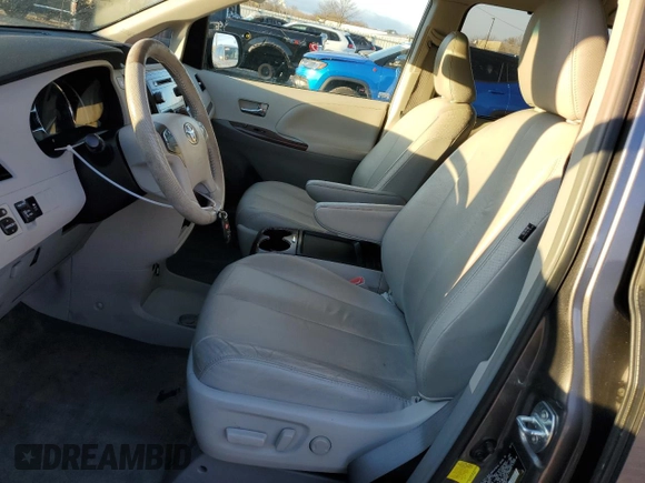 2011 Toyota Sienna XLE AAS with VIN 5TDYK3DC1BS170855, listed as a Copart auction lot 86829904 with 142,117 mi miles and Salvage Title. Bid and sale history available at carsss.com. Image 7.